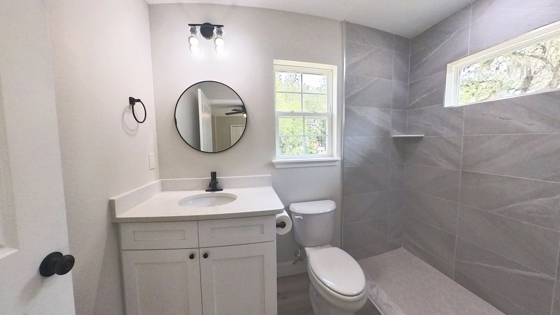 Primary bath with tiled walk-in shower